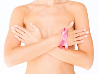 naked woman with breast cancer awareness ribbon